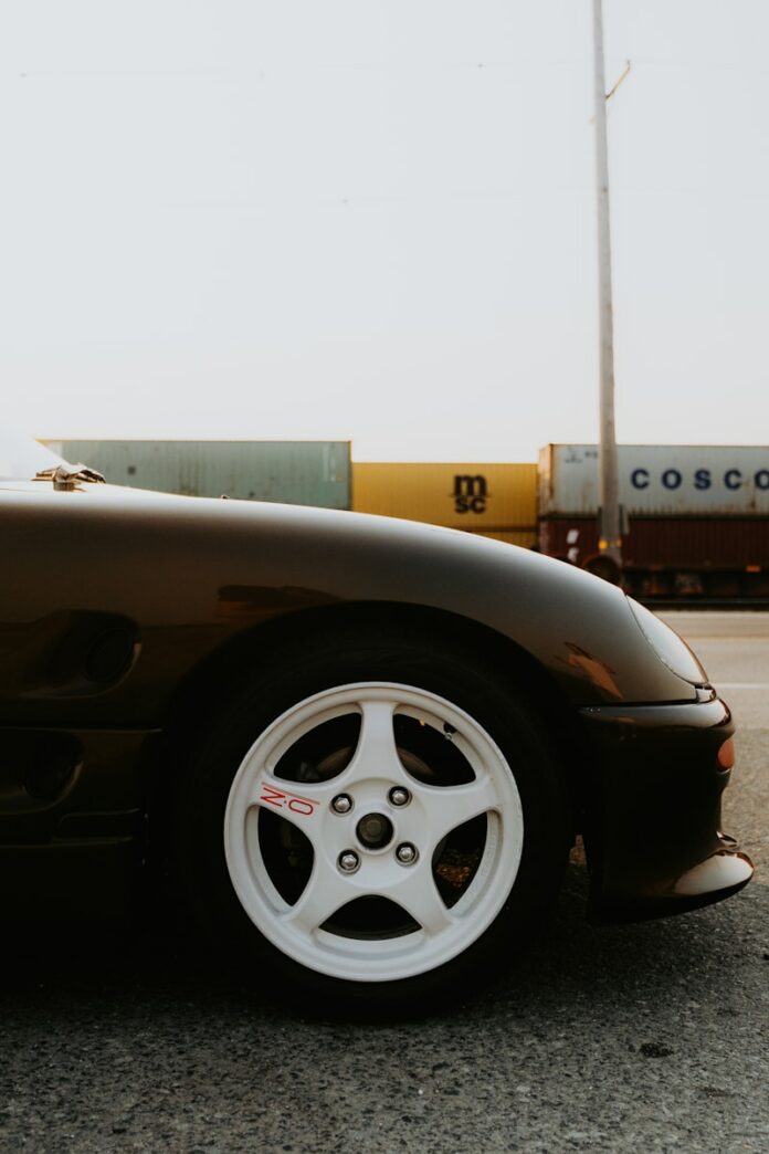A black sports car parked on the side of the road