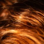 건강한 두피와 머릿결, 일상 속 작은 실천이 만든다 brown hair on black background