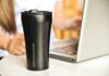 “마시고 채우고, 속도내라”… 현대인 수분 관리 트렌드와 실천법 a black coffee cup sitting next to a laptop