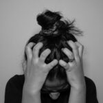 현대인의 스트레스, 일상 속 작은 실천으로 관리한다 a woman covering her face with her hands