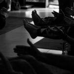 ‘웰니스 회복’, 몸과 마음을 동시에 치유하는 트렌드 People exercising on yoga mats in a studio.